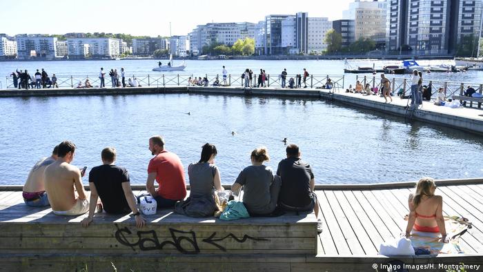 People enjoy warm weather in Stockholm during the coronavirus pandemic