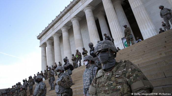 Members of the Washington DC National Guard stand on the steps of the Lincoln Memorial 