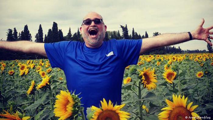 Paul Iarrobino in a field of sunflowers