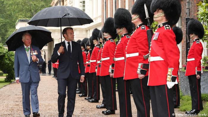 Prince Charles, Prince of Wales and French President Emmanuel Macron inspect the Grenadier Guards at Clarence House