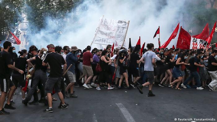 Greece: Violence as thousands march against protest law | News ...
