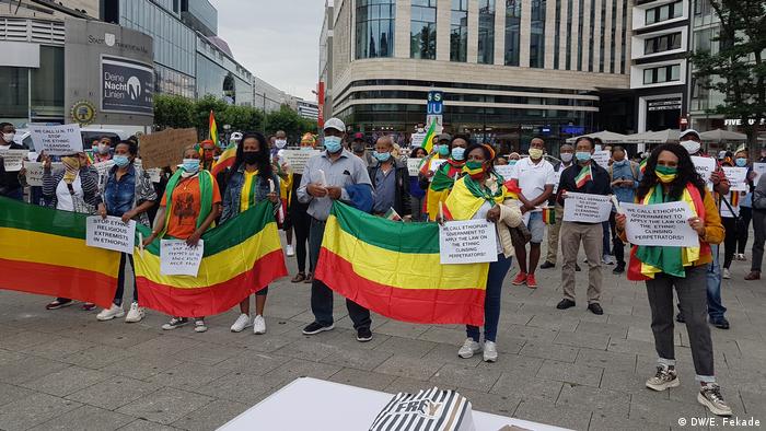 Members of Germany's Ethiopian diaspora hold Ethiopian flags in Frankfurt