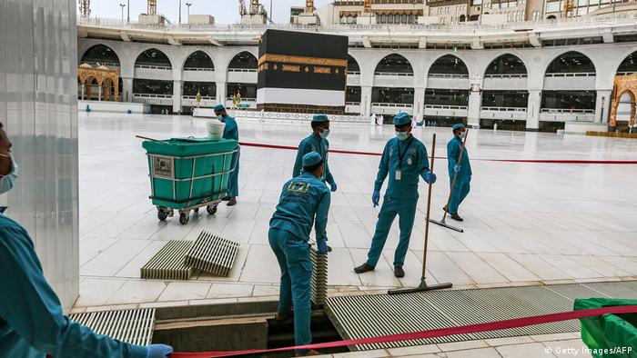 Workers at the Grand Mosque in Saudi Arabia's holy city of Mecca lay out lines to direct pilgrims