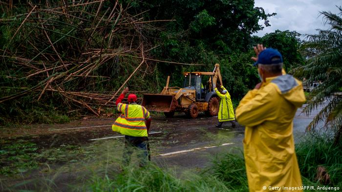 Isaias has torn down trees, flooded streets and knocked out power for thousands of homes and businesses in Puerto Rico