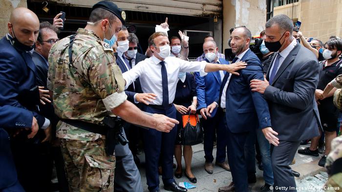 French President Emmanuel Macron gestures as he visits a devastated street of Beirut (Getty Images/AFP/T. Camus)