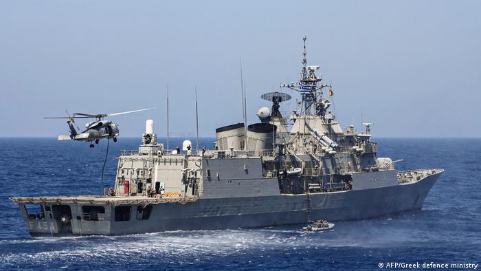 Greek Hydra-class frigate Psara (F-454) of the Hellenic Navy and a military helicopter taking part in a military exercise in the eastern Mediterranean Sea, on August 25, 2020