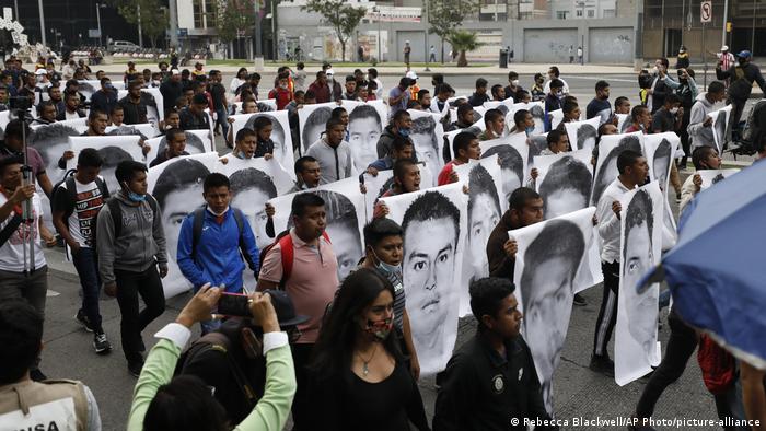 College students and family members of 43 missing students take part in a protest in Mexico