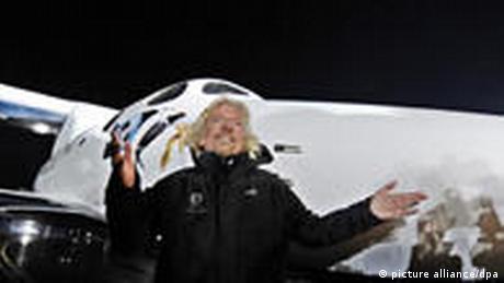 Virgin Group's Richard Branson stands in front of SpaceShipTwo during the rocket plane's worldwide debut.